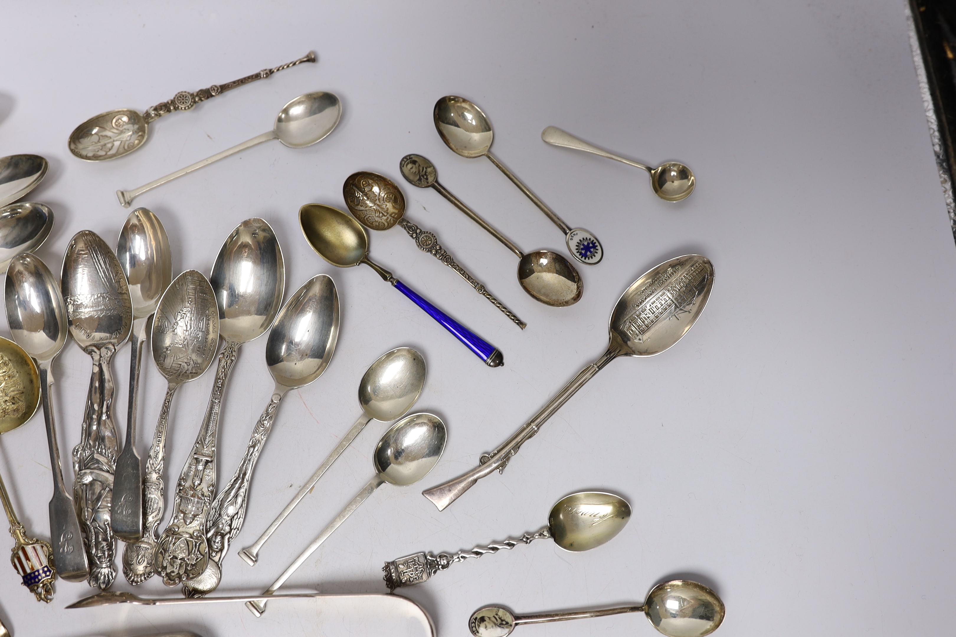 A small group of assorted silver and sterling small spoons, including commemorative etc. and some continental white metal spoons.